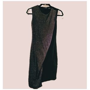 Press. Asymmetrical little black dress.